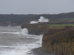 LZ00580 Waves crashing against cliffs at Llantwit Major beach.jpg
